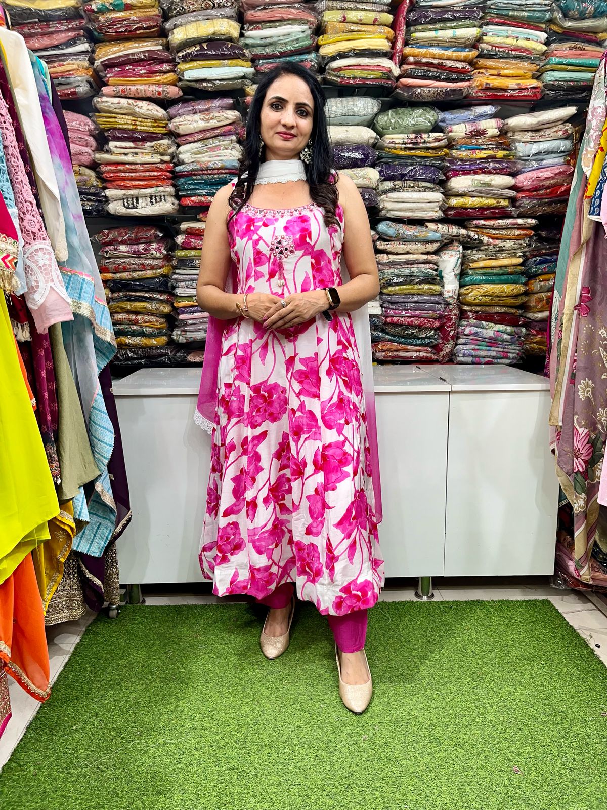 A vibrant designer digital print Anarkali set featuring intricate patterns, featuring a long flowing kurta with detailed motifs, paired with matching churidar and a stylish dupatta, perfect for festive and special occasions.