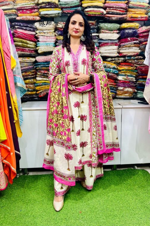 Premium pure cotton Anarkali featuring intricate embroidery on the neckline, complemented by a flared palazzo and a pure cotton dupatta.