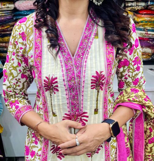 Premium pure cotton Anarkali featuring intricate embroidery on the neckline, complemented by a flared palazzo and a pure cotton dupatta.