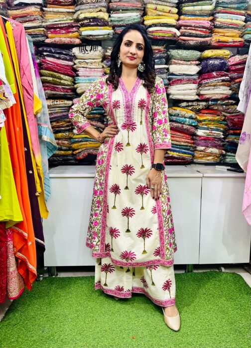 Premium pure cotton Anarkali featuring intricate embroidery on the neckline, complemented by a flared palazzo and a pure cotton dupatta.