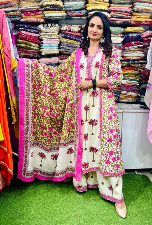 Premium pure cotton Anarkali featuring intricate embroidery on the neckline, complemented by a flared palazzo and a pure cotton dupatta.
