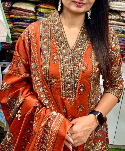 Premium pure cotton Anarkali with embroidered neckline, complemented by a flared plazzo and a pure cotton dupatta.