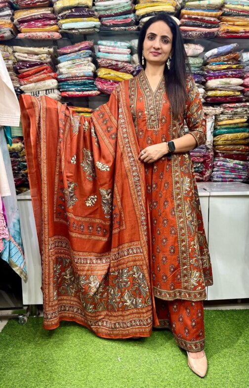 Premium pure cotton Anarkali with embroidered neckline, complemented by a flared plazzo and a pure cotton dupatta.