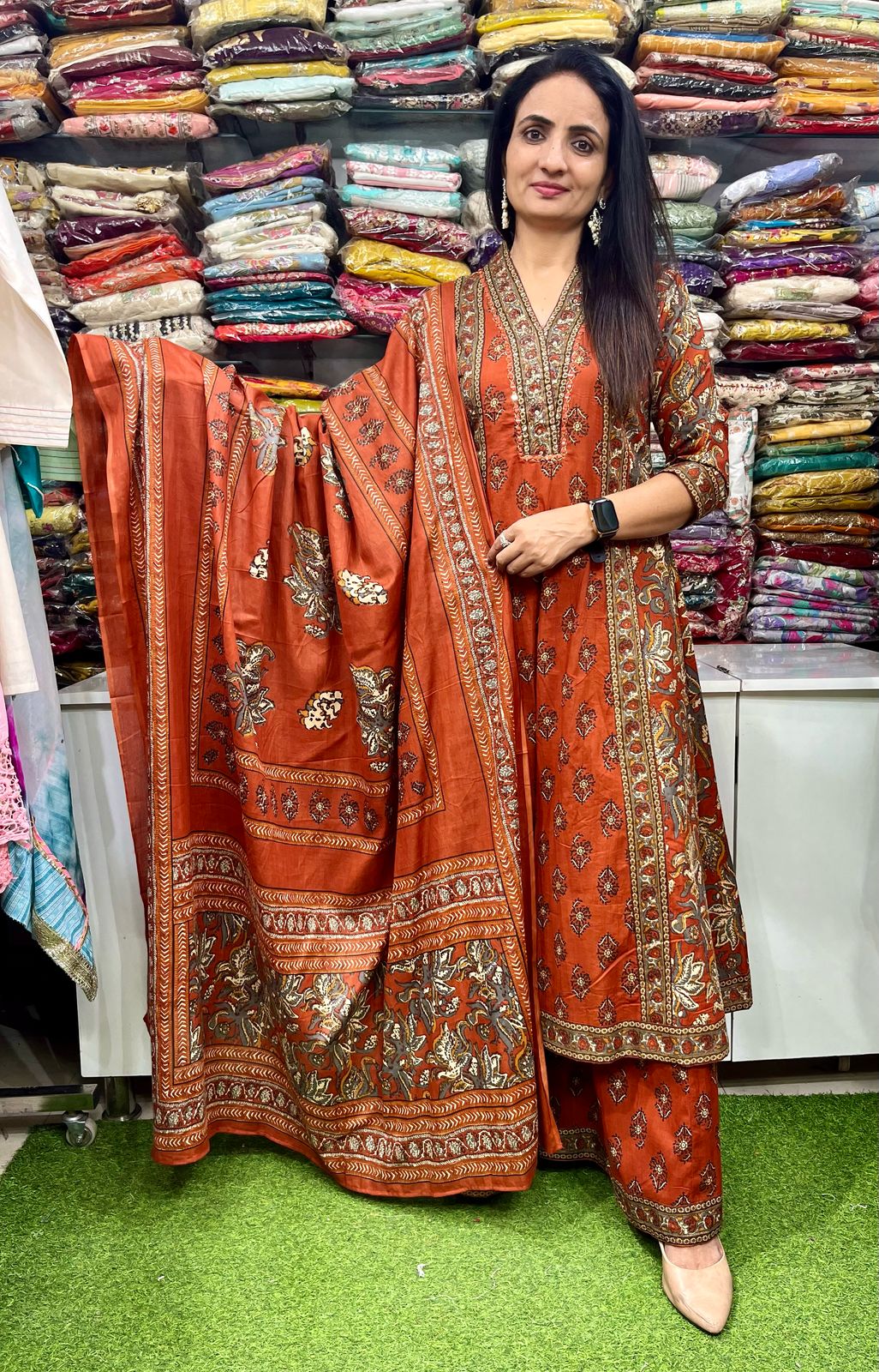 Premium pure cotton Anarkali with embroidered neckline, complemented by a flared plazzo and a pure cotton dupatta.
