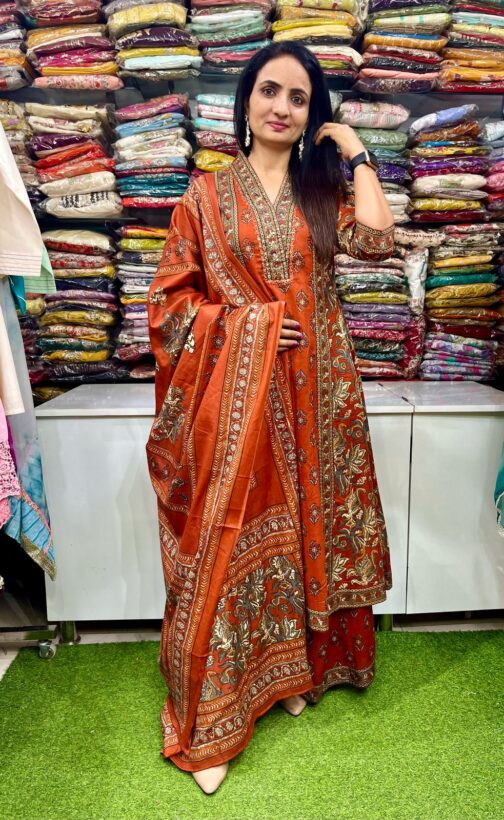 Premium pure cotton Anarkali with embroidered neckline, complemented by a flared plazzo and a pure cotton dupatta.