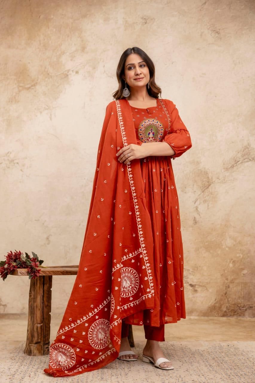 Premium pure cotton Anarkali with embroidered neckline, styled with matching pants and a pure cotton dupatta.